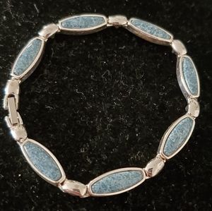 Silvertone bracelet with blue stones
